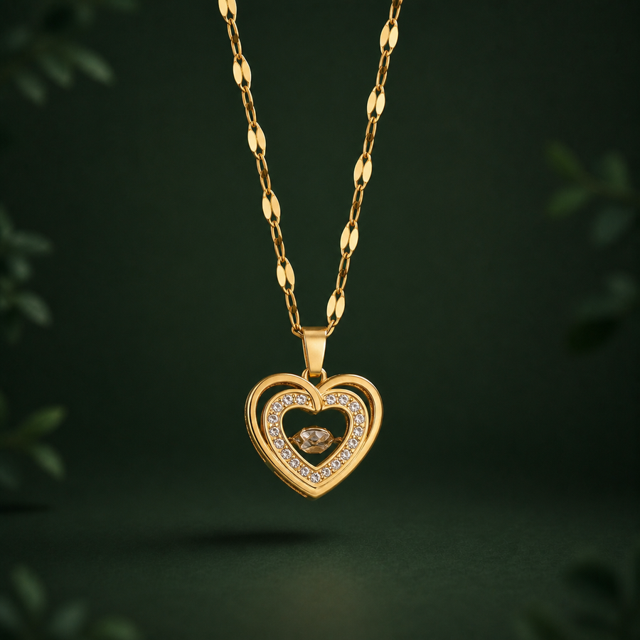 Collier Double Cœur Éclat doré sur fond vert forêt