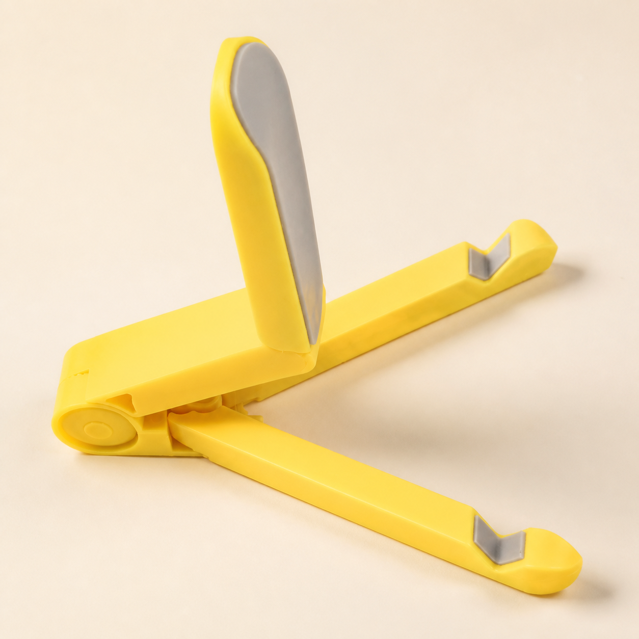 Support pliable jaune pour téléphone et tablette — Yellow foldable phone and tablet stand
