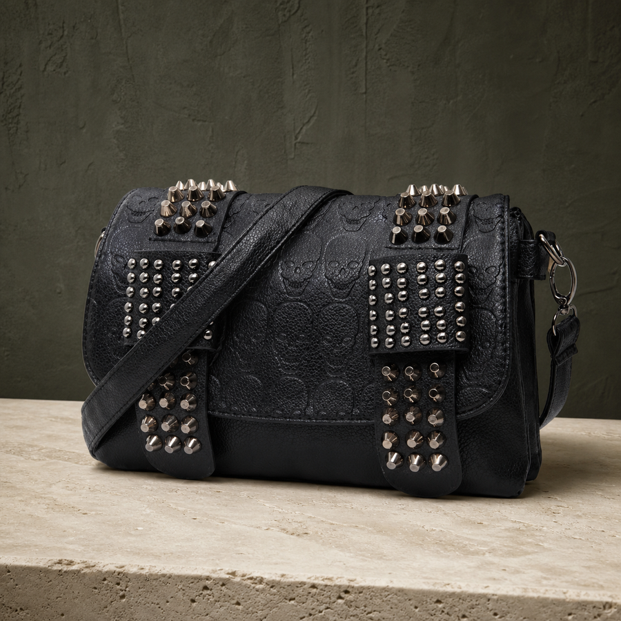 Sac bandoulière noir à rivets et crânes embossés — vue avant